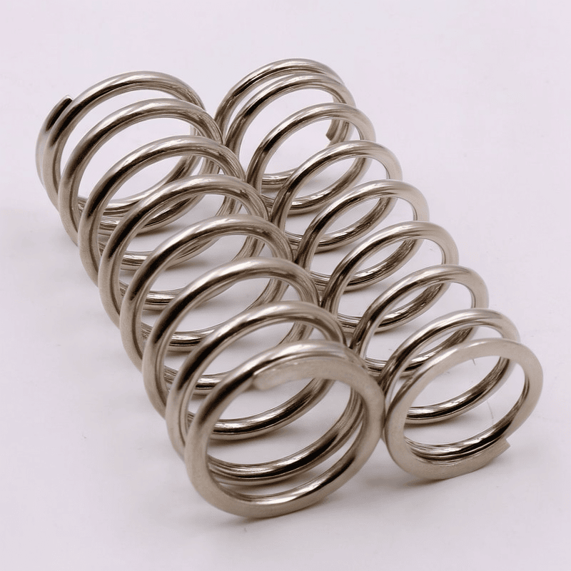 Large polished compression spring pair