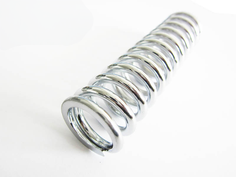 Single polished compression spring close up
