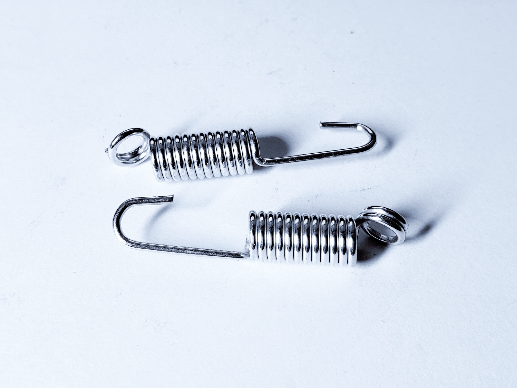 Extension springs with open hook ends