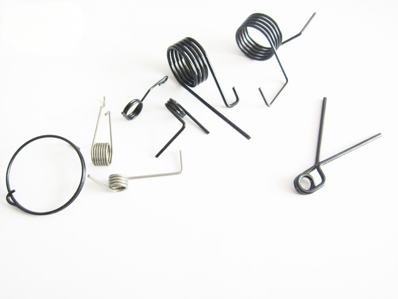 Custom torsion spring assortment with varied leg geometry
