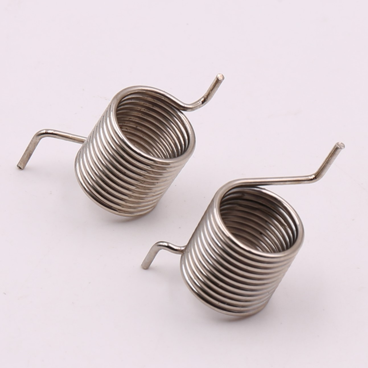 Large torsion spring pair with U shaped legs