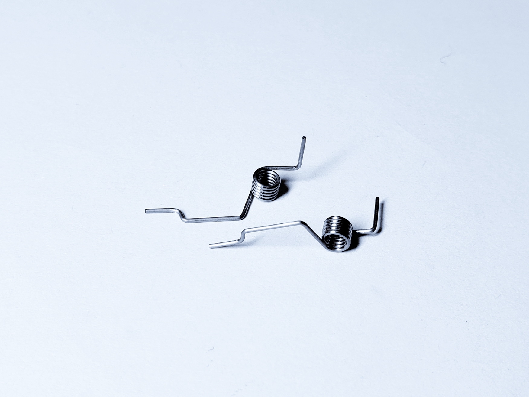 Small black torsion springs with bent legs
