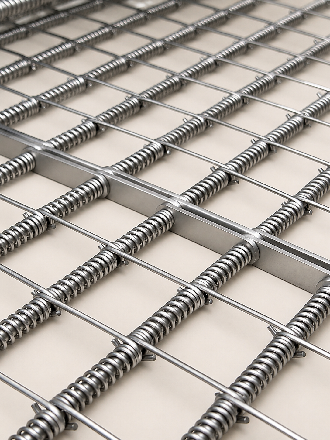 Open grid spring rod wire conveyor belt close up